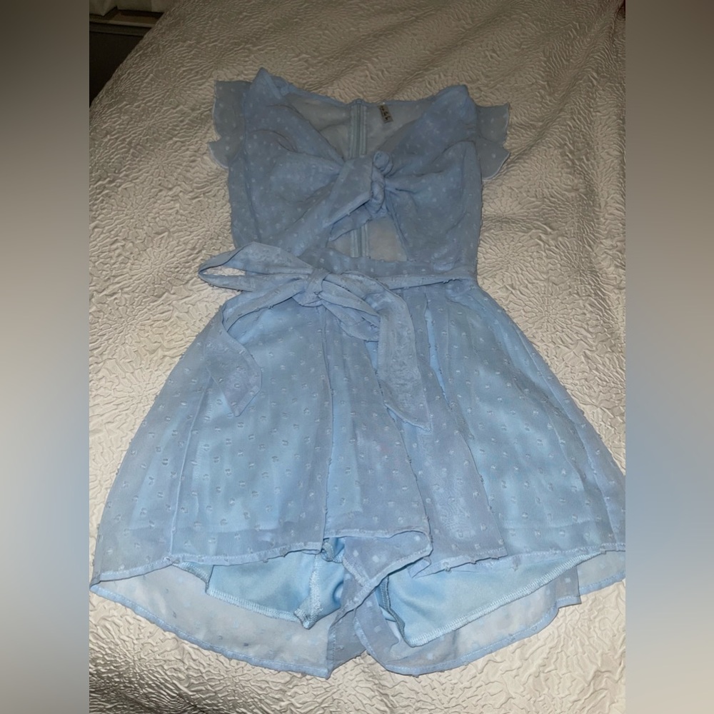 Baby blue romper. Size SMALL, never worn, brand new! Brand is Lucy in the sky!